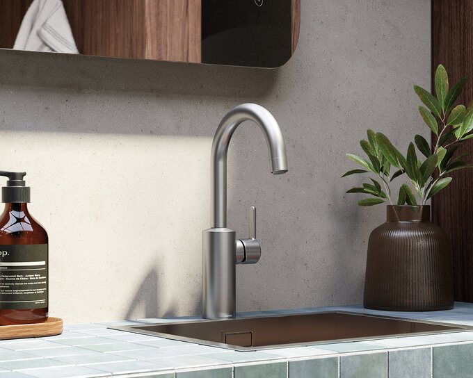 Basin mixer with high spout steel