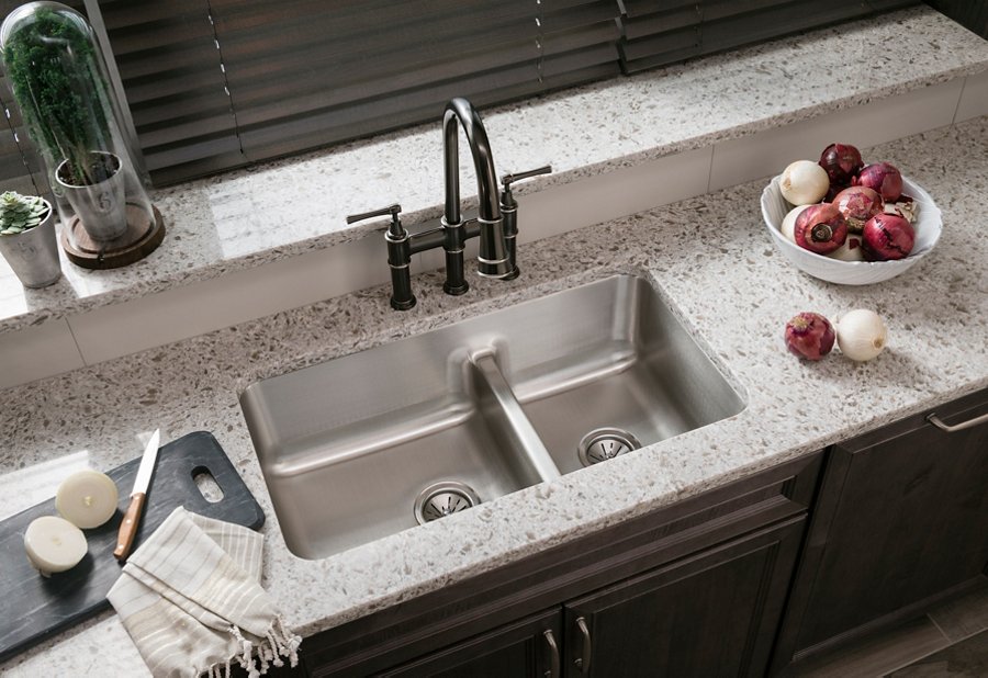 Explore™ Three Hole Bridge Faucet with Pull-down Spray and Lever Handles